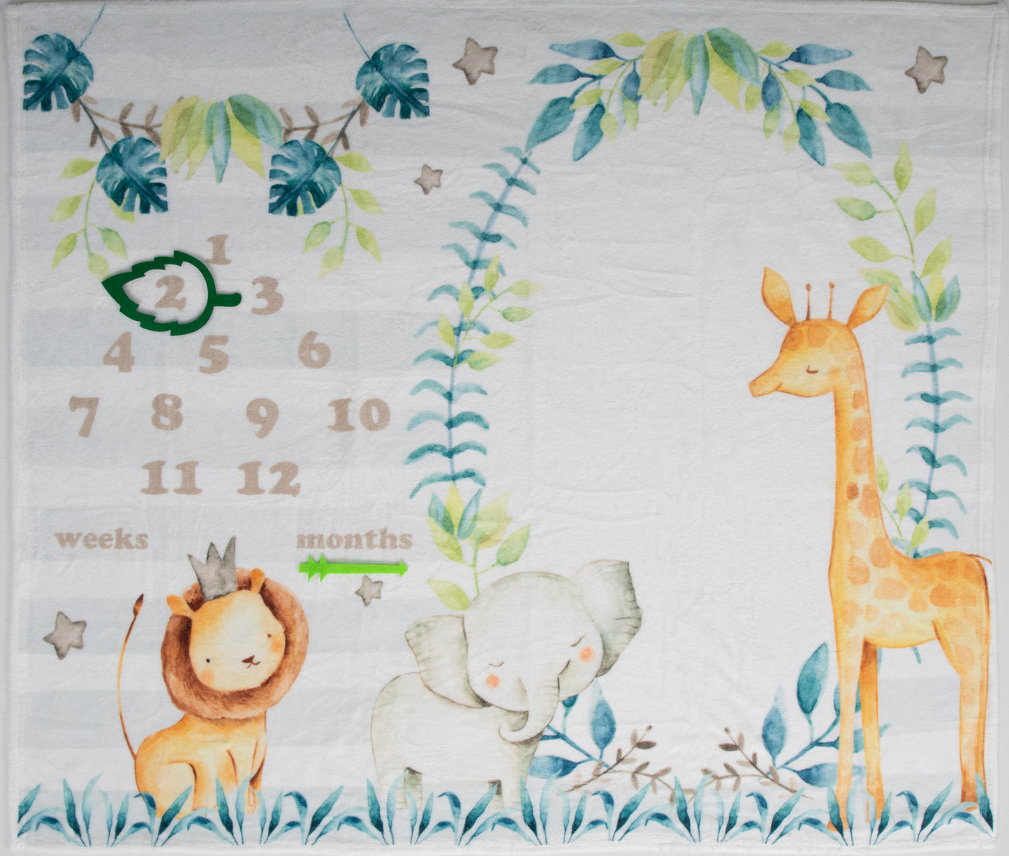 The blanket is made from soft, plush,and hypoallergenic fabric, ensuring your baby's comfort during every photoshoot. Its design features a lush leafy background with vibrant colors, where a cast of adorable baby safari animals roam freely. It's the perfect scene creating a visually stunning backdrop for your baby's journey through their first year.