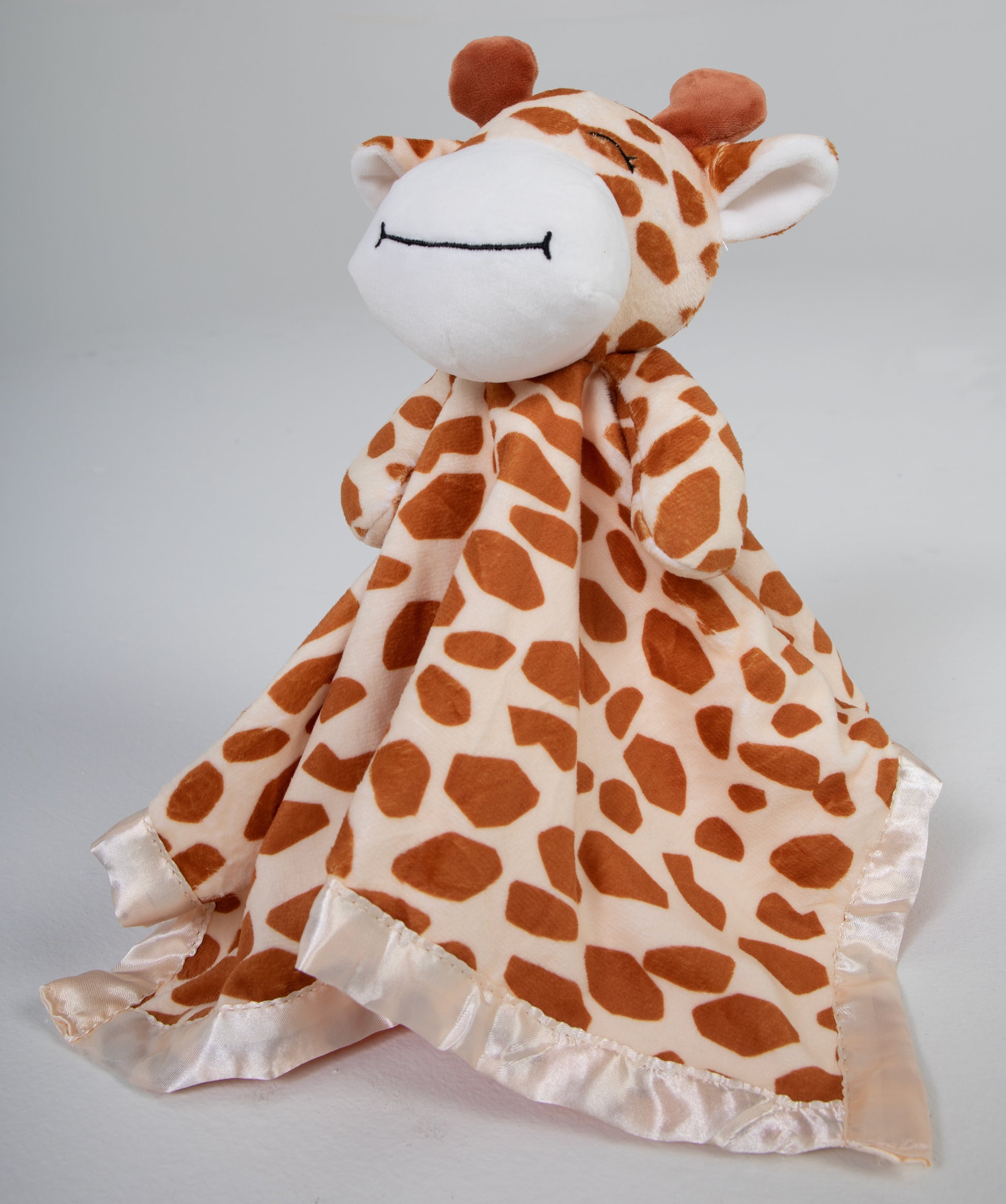 Our adorable stuffed giraffe lovey and security blanket companion is the perfect cuddly friend for your baby. Crafted with love, it's sure to provide comfort and companionship throughout the early years.  Made of soft plush and lined with satin, this lovable animal is sure to be your baby's new best friend.