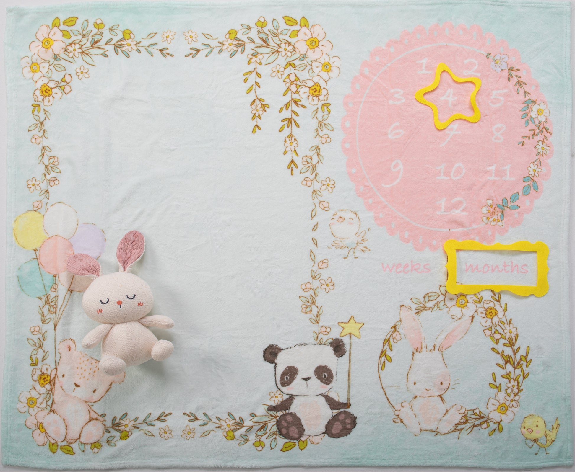 The blanket is generously sized ( 39" W x 47" H) and made from soft, breathable, and hypoallergenic fabric, ensuring your baby's comfort during every photoshoot. The soft and muted pastel colors create a soothing and enchanting backdrop for your baby's monthly milestone photos, adding a touch of nature's wonder to every snapshot.