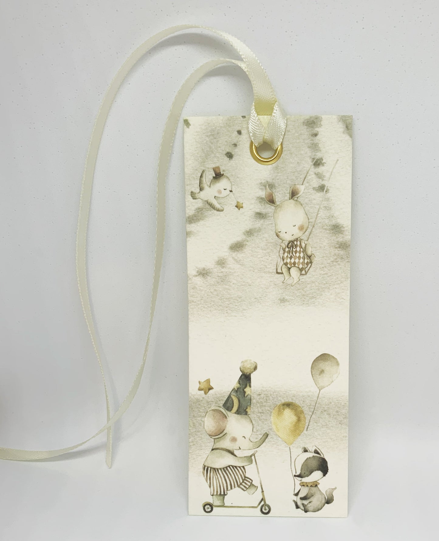 Capture the precious moments and milestones of your baby's early years while ensuring you never lose your place in your favorite parenting reads with our woodland friends enchanted circus bookmark and gift card. Crafted with a luxuriously smooth satin ribbon, this bookmark not only marks your page but also adds a touch of sophistication to your baby book.