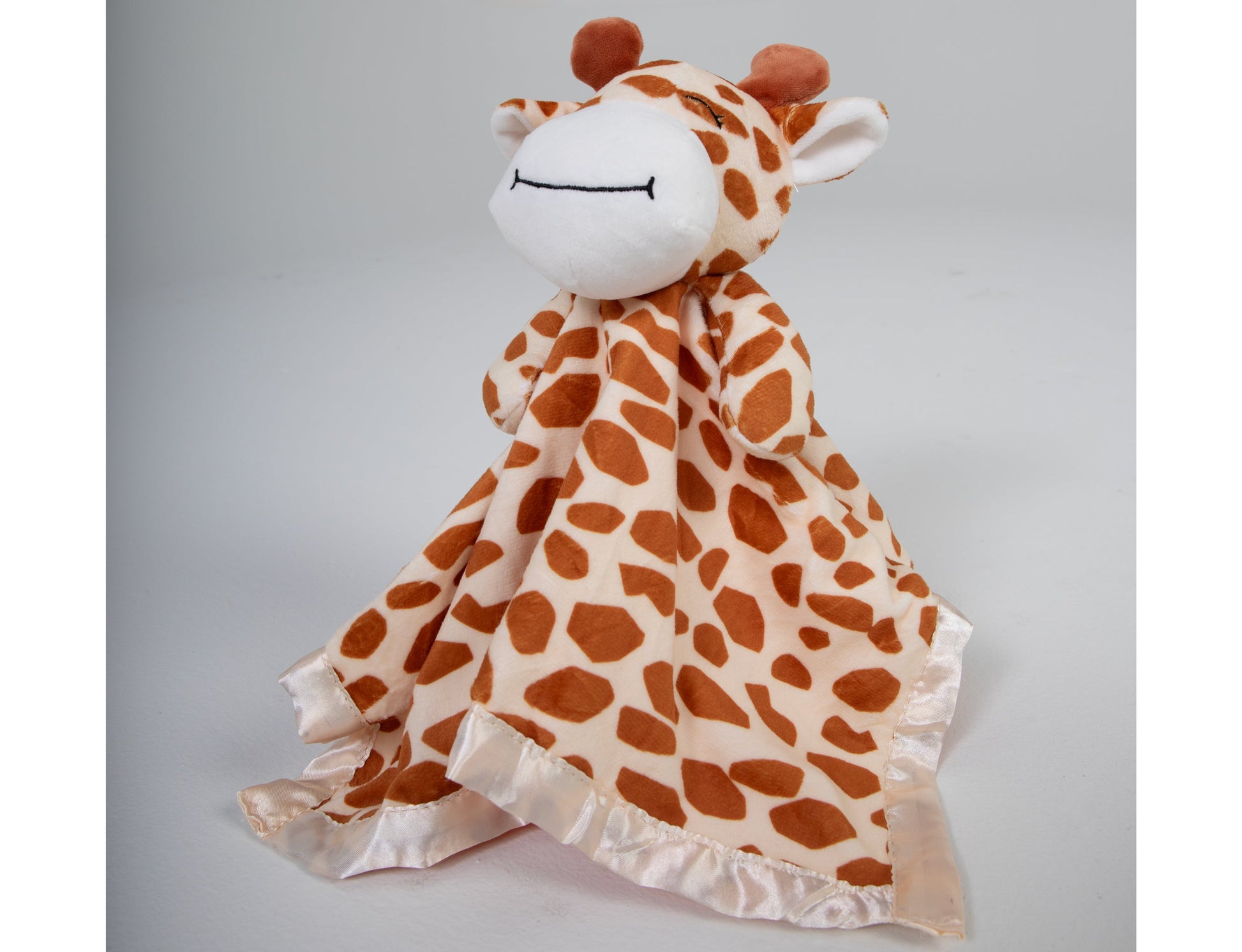 Our adorable stuffed giraffe lovey and security blanket companion is the perfect cuddly friend for your baby. Crafted with love, it's sure to provide comfort and companionship throughout the early years.  Made of soft plush and lined with satin this lovable animal is sure to be your baby's new best friend.
