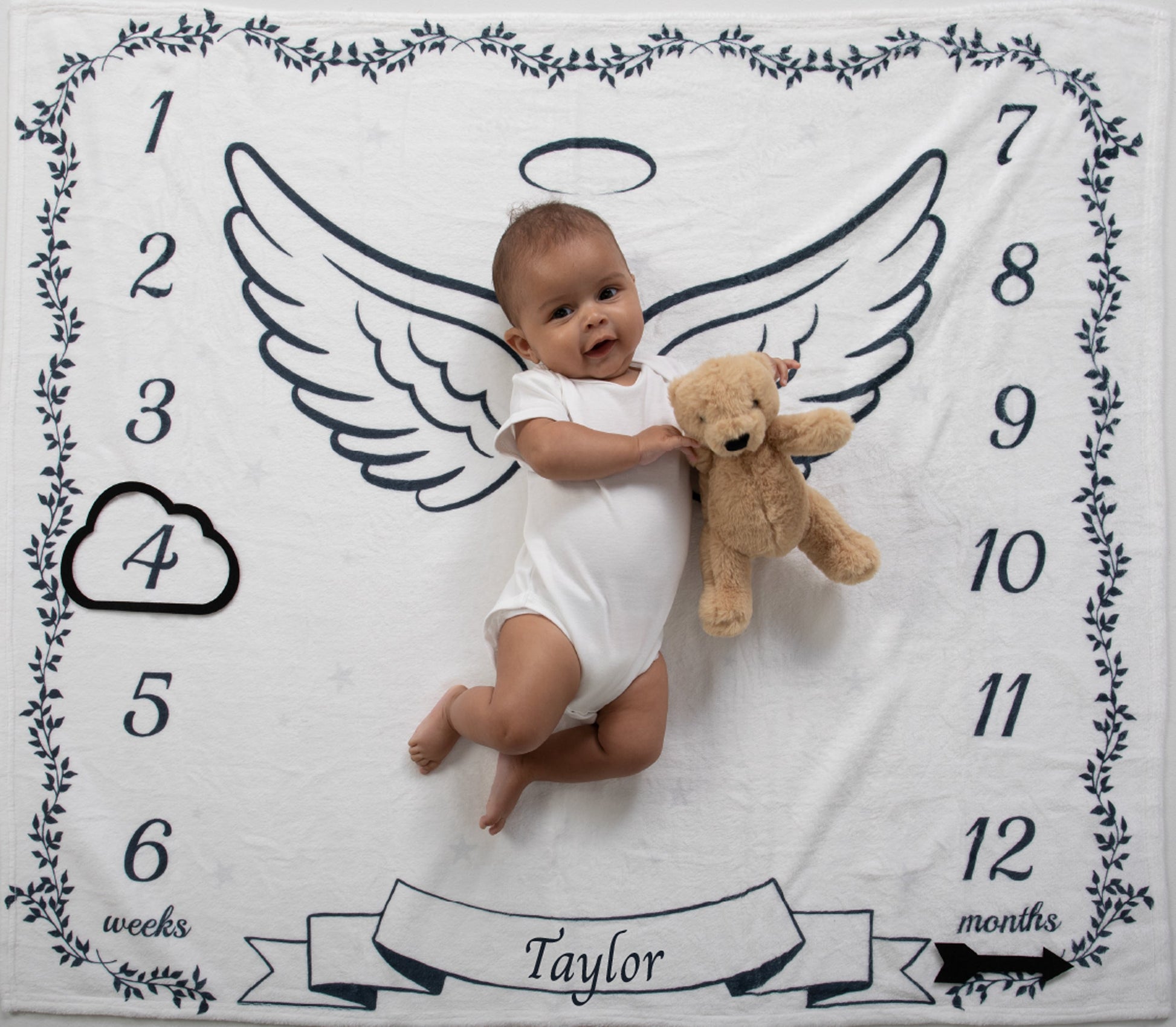 Capture the magic of your baby's growth with our soft and adorable heavenly dreams milestone blanket. Crafted from plush, high-quality material, this blanket features a whimsical angel wings and halo design that makes it perfect for monthly photo sessions. Watch your little one grow, and create a heartwarming keepsake of their first year.