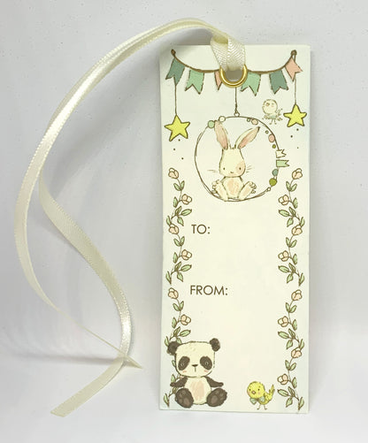 Capture the precious moments and milestones of your baby's early years while ensuring you never lose your place in your favorite parenting reads with our bunny and friends bookmark and gift card. Crafted with a luxuriously smooth satin ribbon, this bookmark not only marks your page but also adds a touch of sophistication to your baby book.