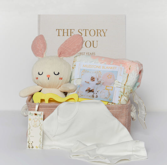 Introducing our Milestone Moments Gift Basket - the perfect way to celebrate every precious moment in a baby's journey. Whether you're welcoming a new addition to the family or attending a baby shower, this thoughtfully curated gift basket is sure to bring joy and create lasting memories.