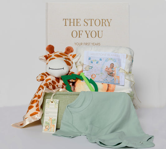 Introducing our Wildlife Wonderes Safari Animals Milestone Moments Gift Basket - the perfect way to celebrate every precious moment in a baby's journey. Whether you're welcoming a new addition to the family or attending a baby shower, this thoughtfully curated gift basket is sure to bring joy and create lasting memories.
